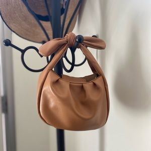 Anthropologie faux leather handbag w/ detachable hidden strap.